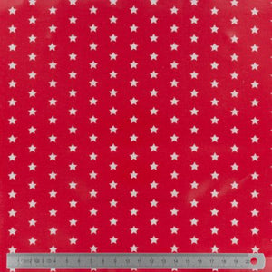 Tissu Fryett's enduit étoile blanche fond rouge 100 % coton et PVC 132 cm
